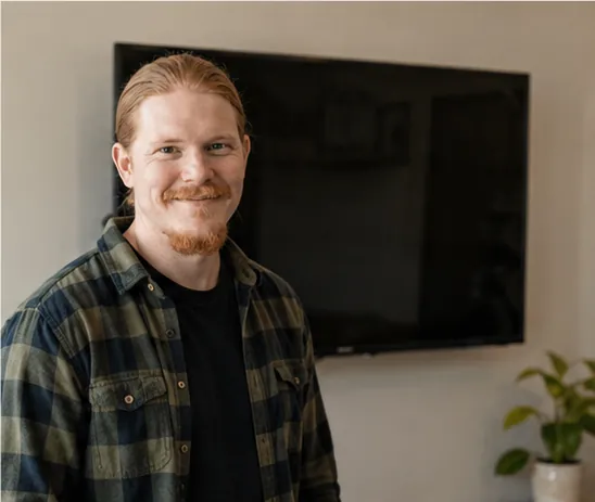 Rusty standing in front of a finished wall mounted TV